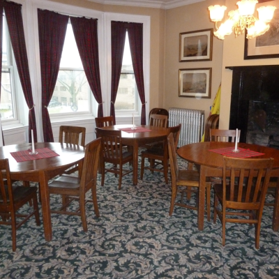 The membership gathers around the tables for meals and receptions held in The Rooms.