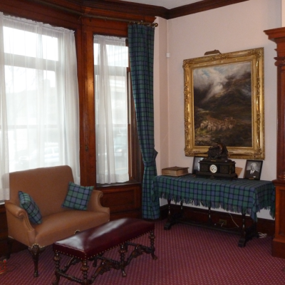 Paintings and memorabilia of the Society enhance the ambience of the room.