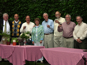 Members and their guests enjoy an evening in the garden