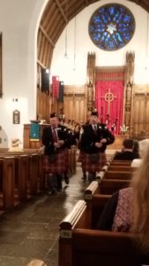 Pipe Major Peter leads the band in the sanctuary of the church